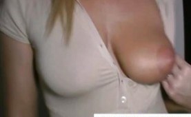 Busty blonde gets naked in a gloryhole booth and sucks